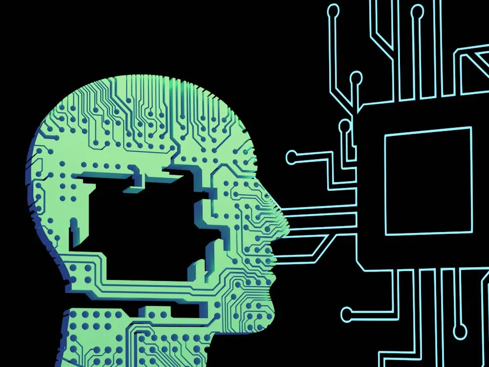 An illustration of a human head linked to a circuit board