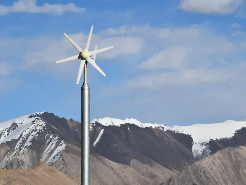 Small three-blade wind turbine on a tall pole
